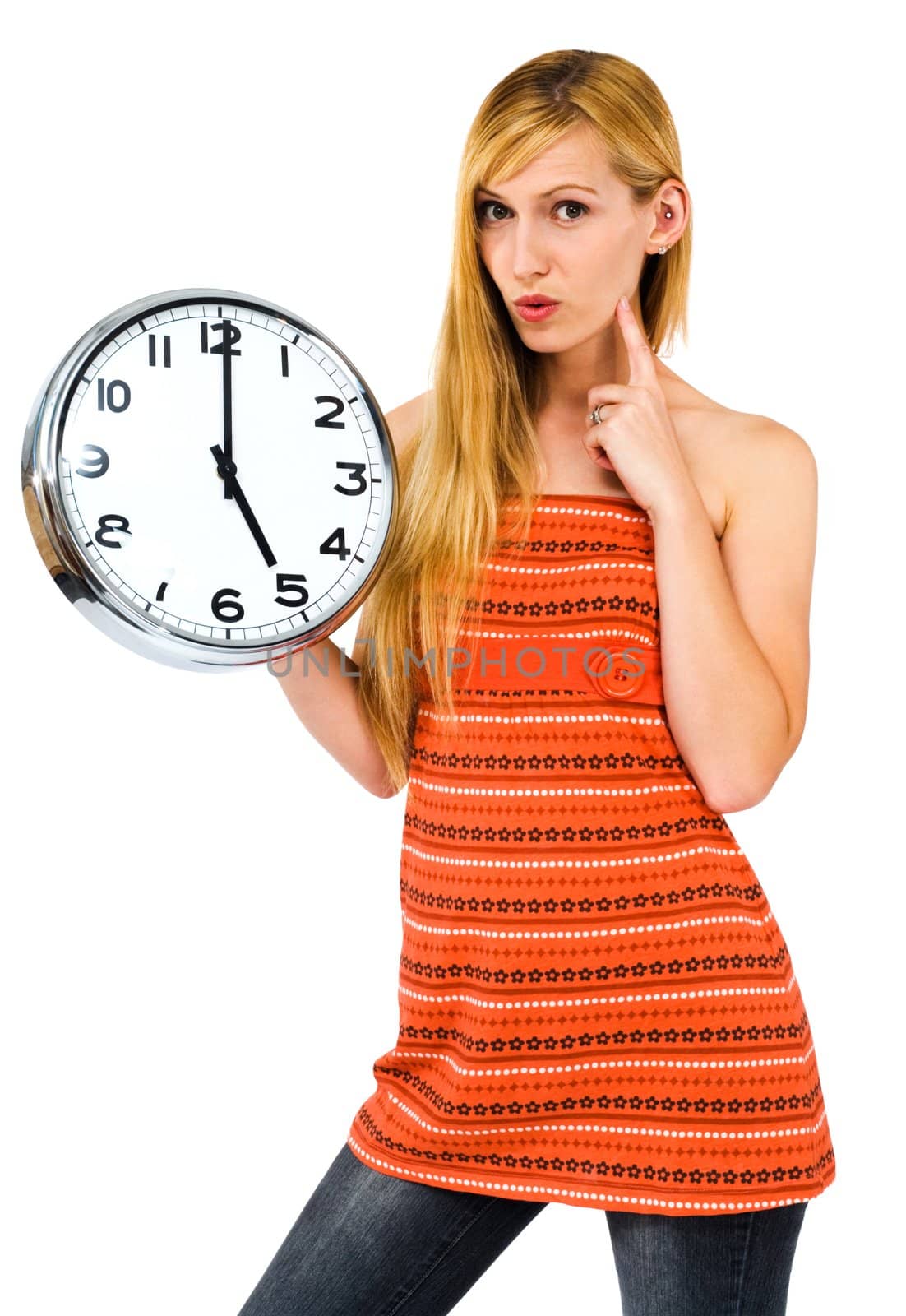 Young woman holding a clock and thinking isolated over white