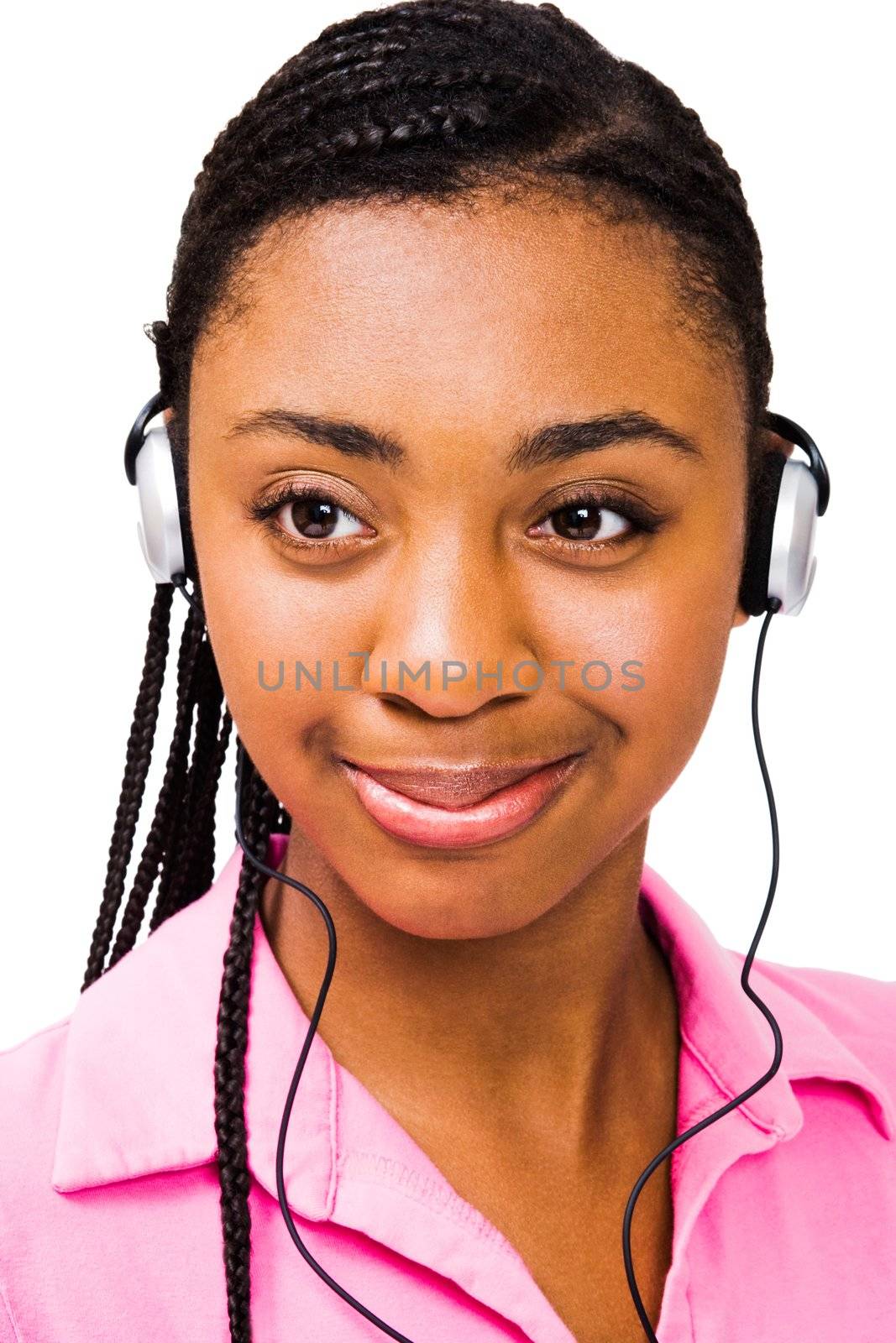 Fashion model listening to music on headphones isolated over white