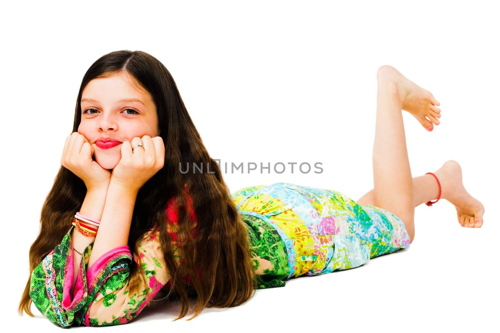 Lying girl posing and smiling isolated over white