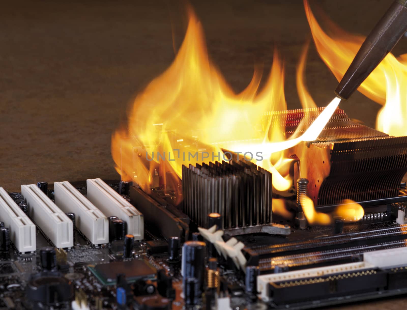 burning computer main board in rusty background. Copyspace