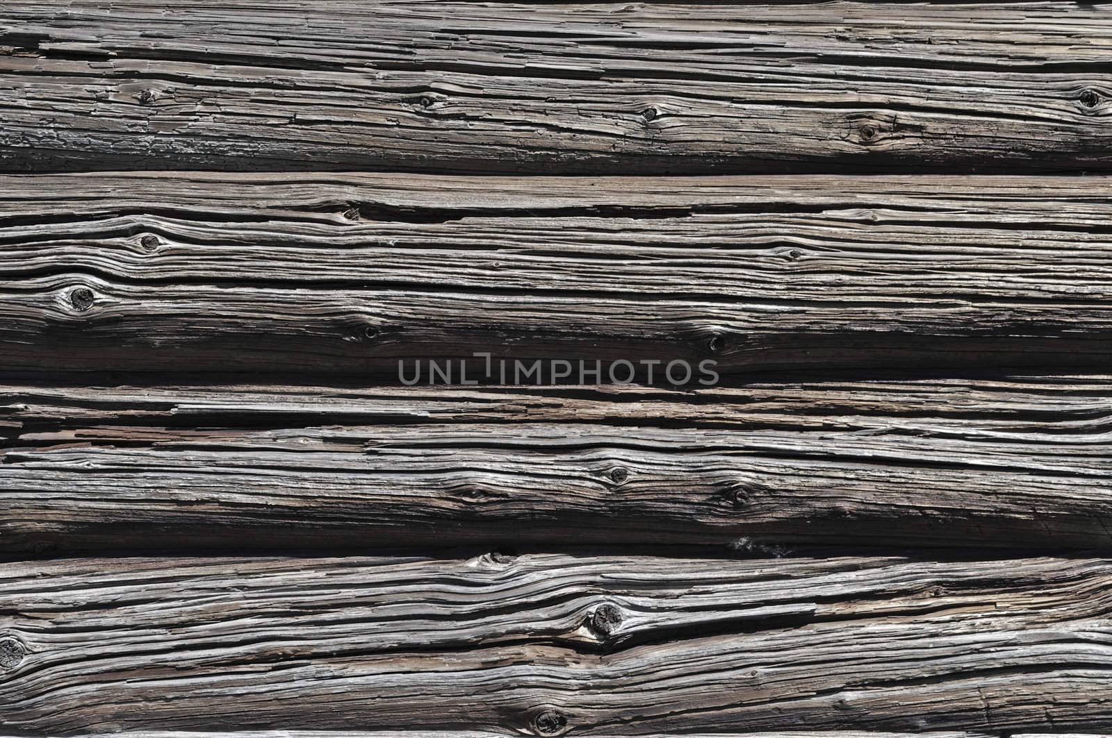 Fragment of log wall background of old wooden barn