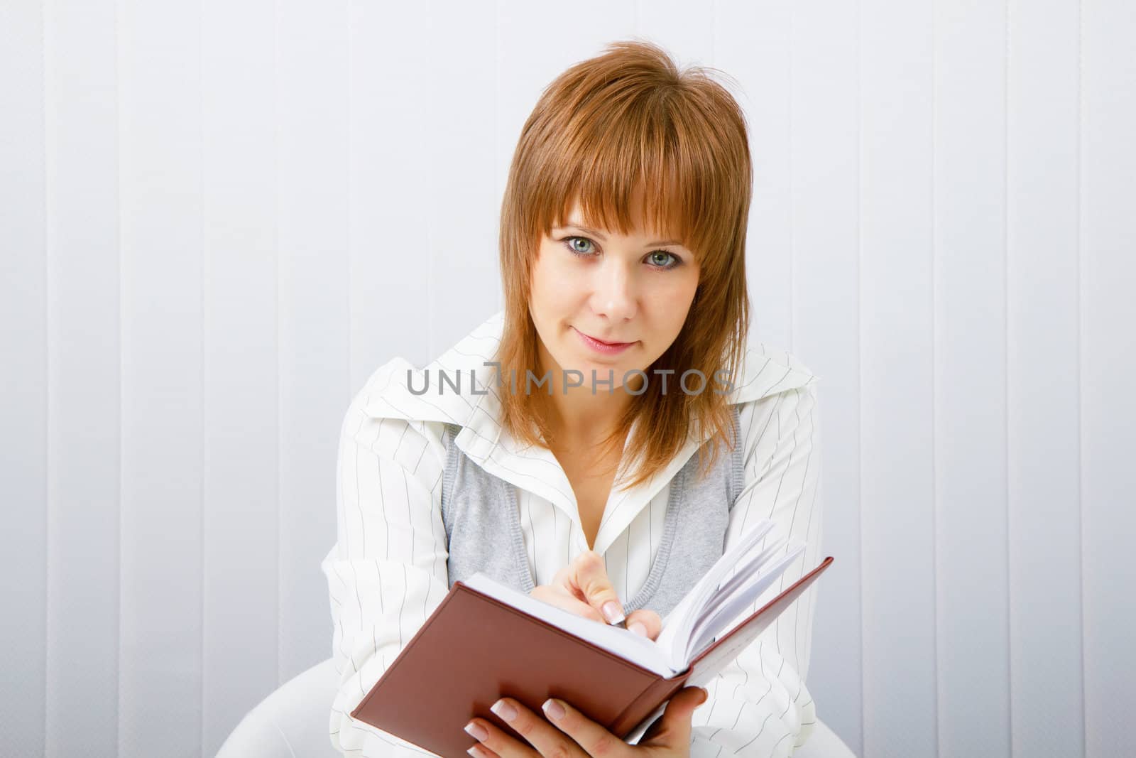 Business woman with notebook in the office
