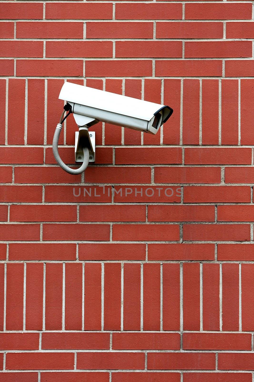 Security camera on a brick wall
