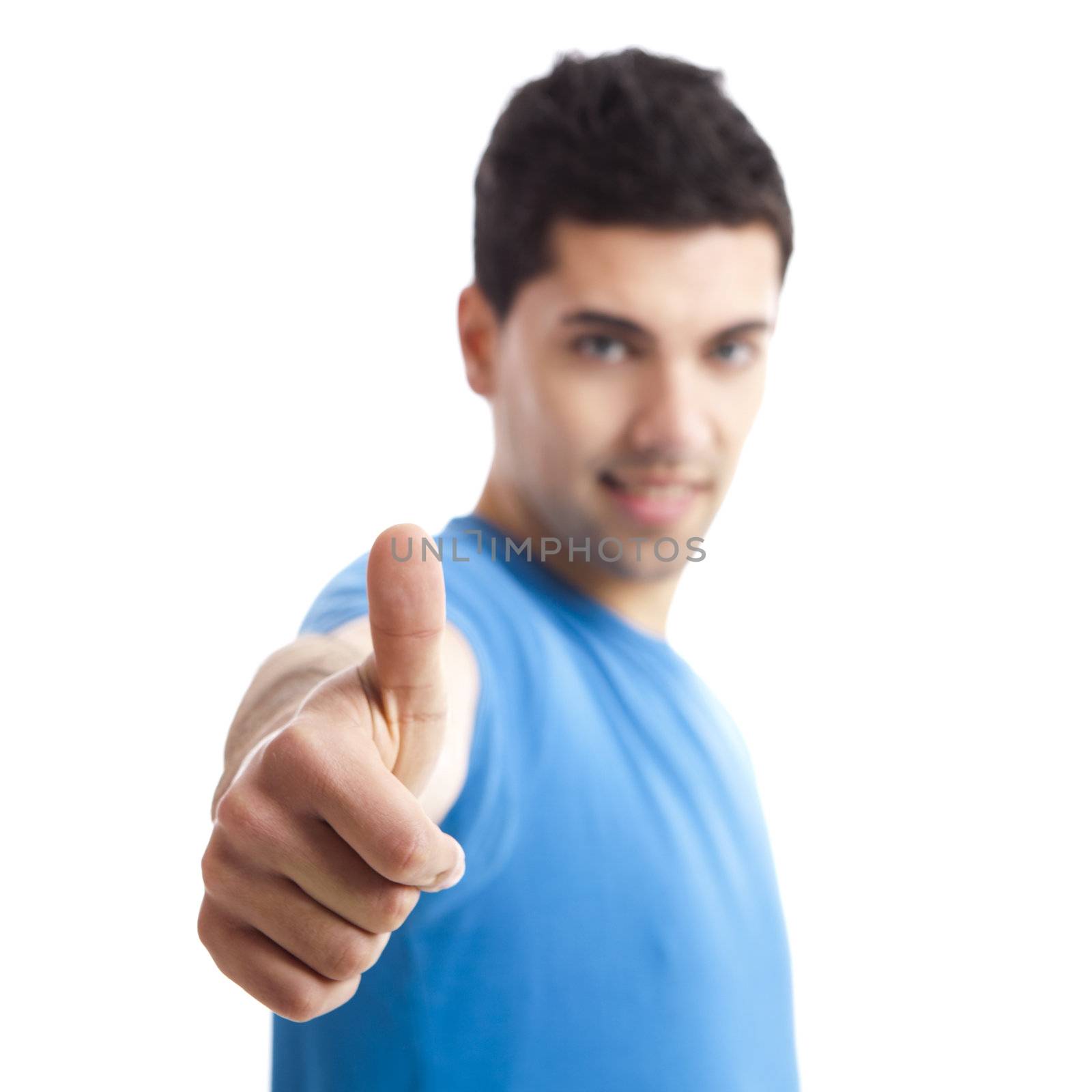 Handsome young man with thumbs up on an isolated white background 