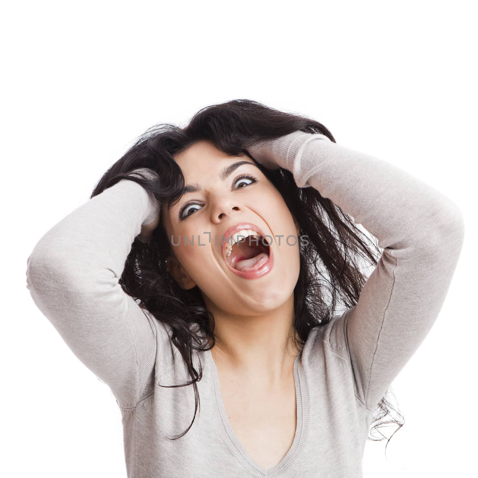 Portrait of a  young woman with a crazy expresion, isolated over white background