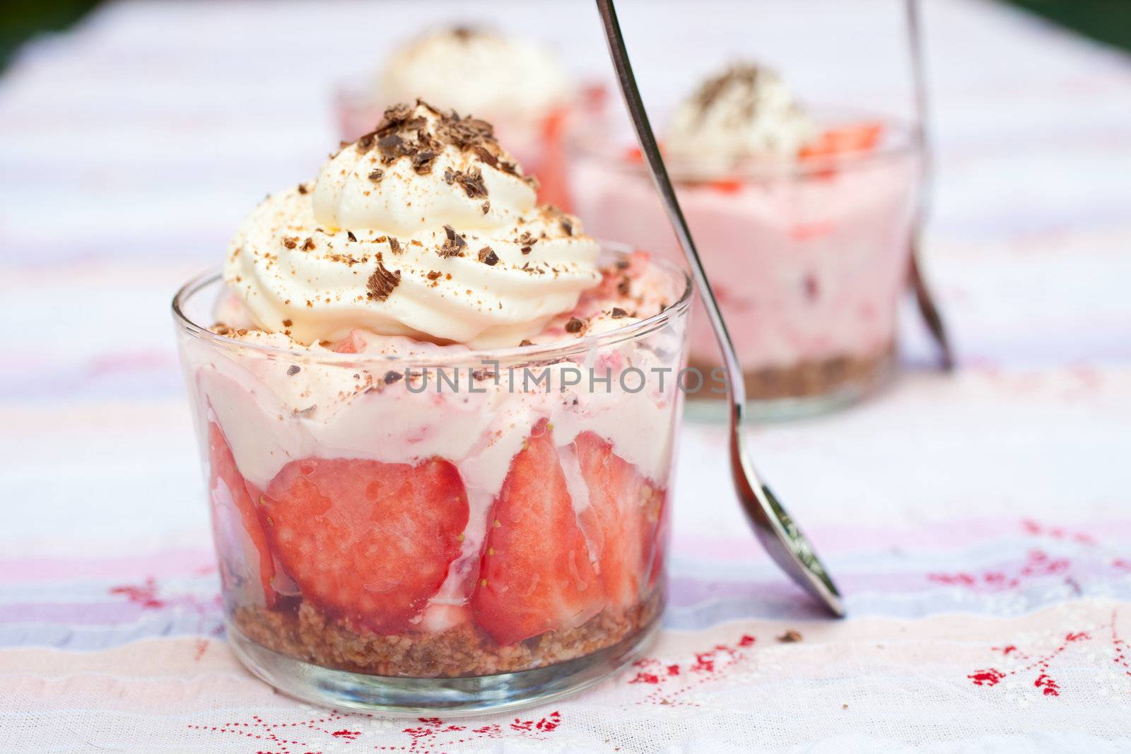 Fresh dessert with strawberries, mascarpone and chocolate bits