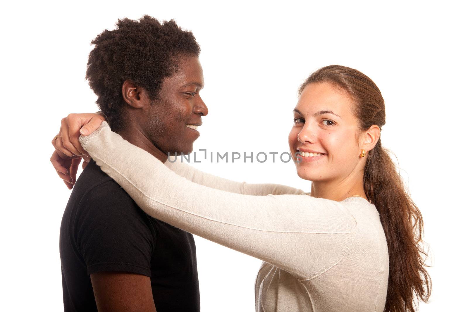 a multiracial couple posing together holding each other