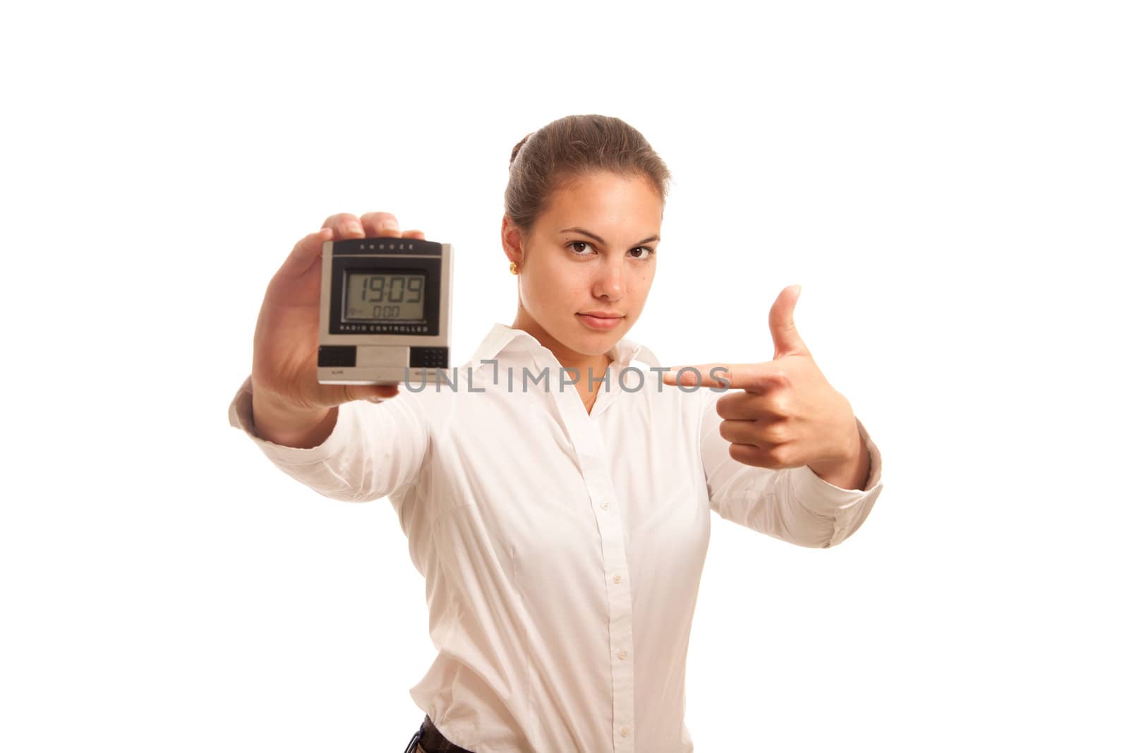 a young businesswoman looking angry while pointing on a clock