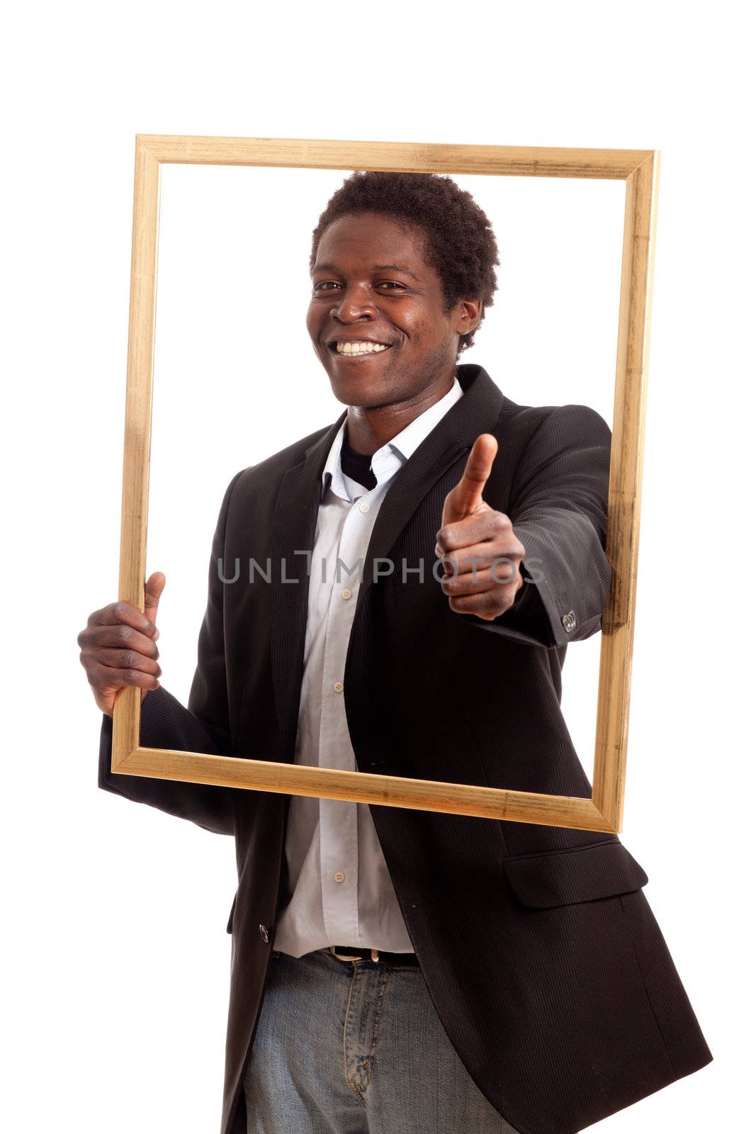 a dark skinned businessman holding a frame showing thumb up