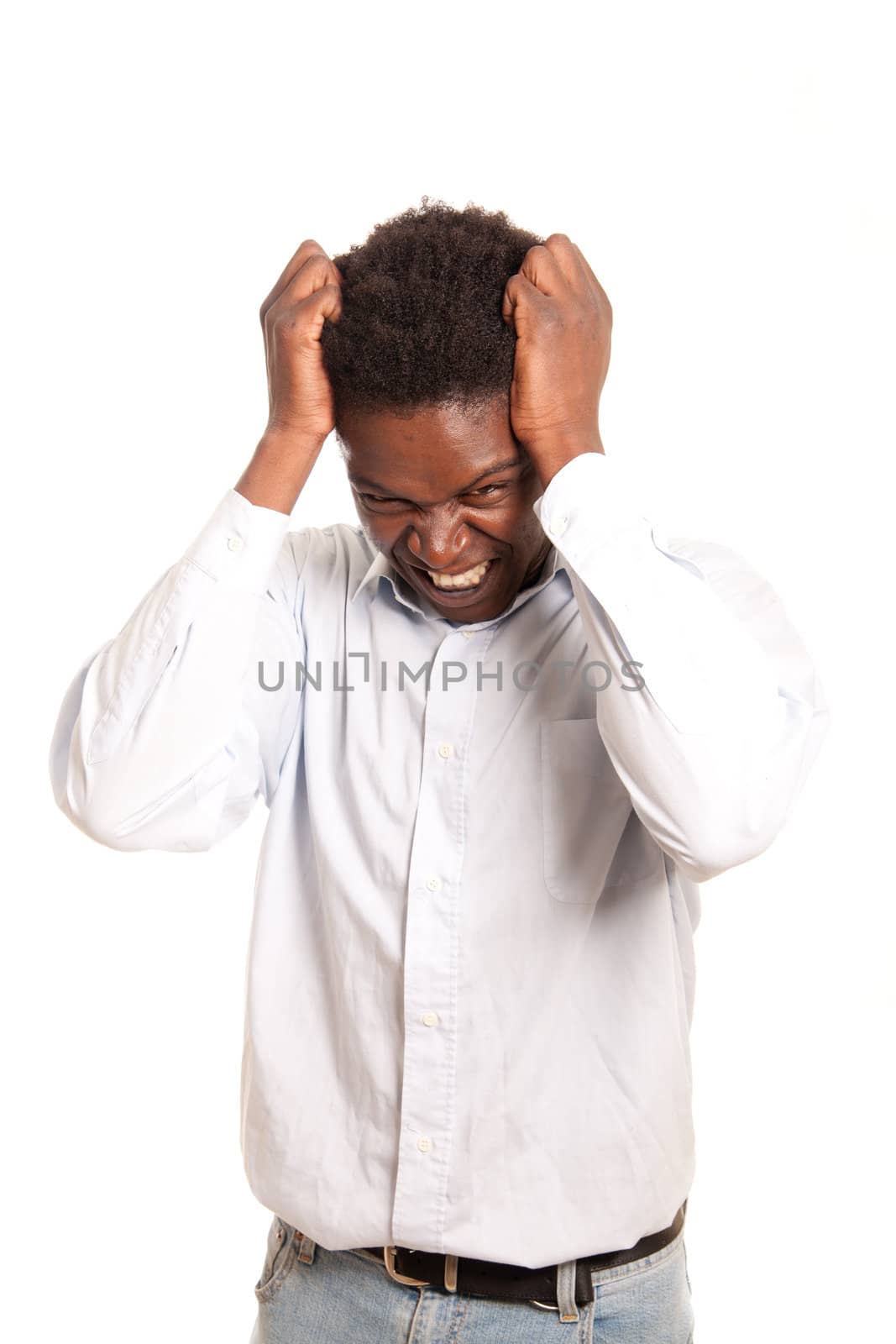 a dark skinned man posing frustrated with hand in the hair