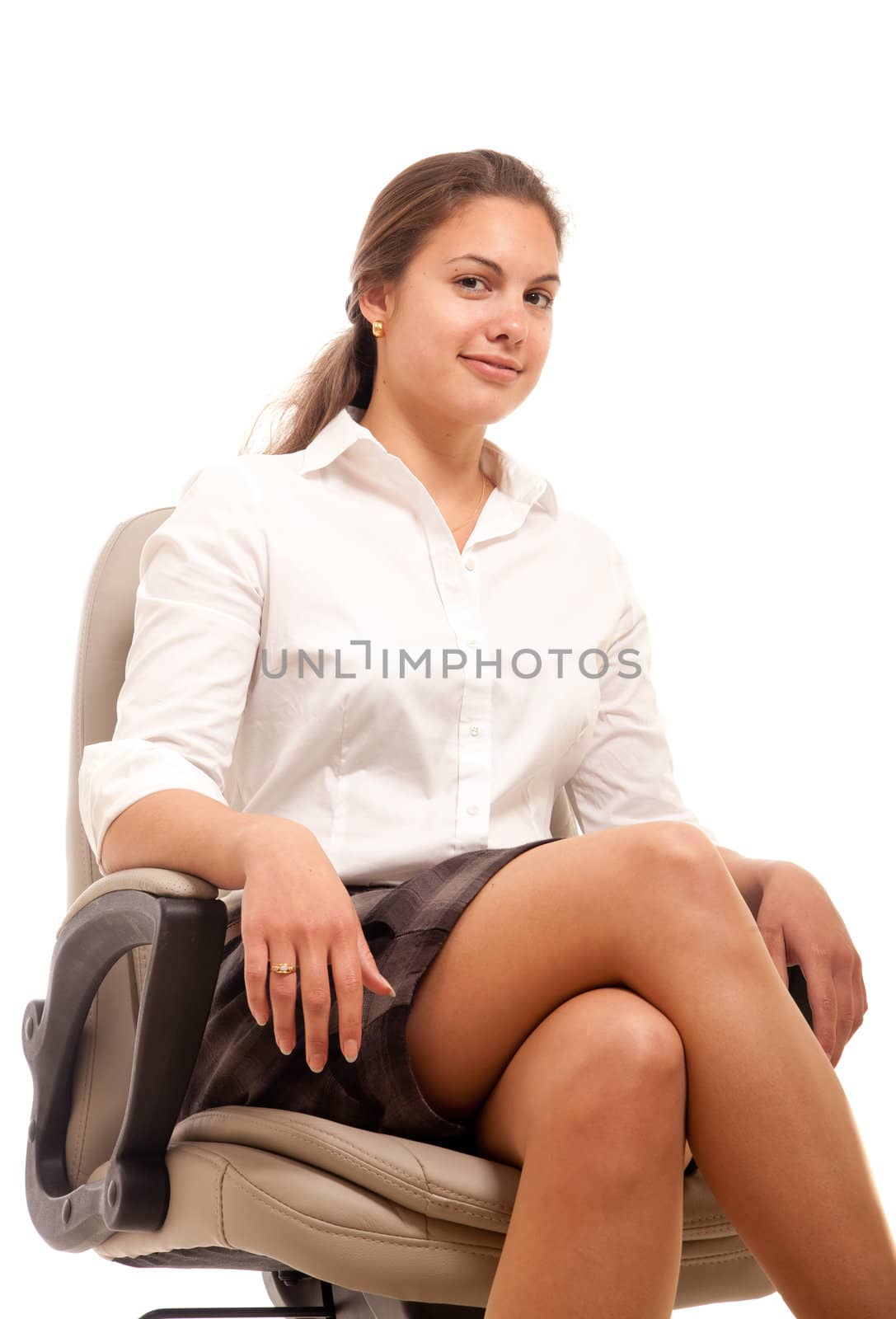 a young businesswoman posing in an office chair