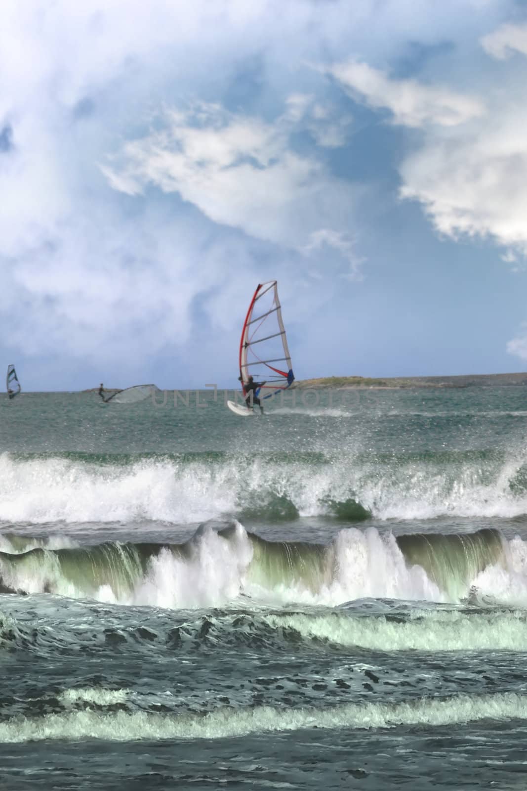 many surfers windsurfing in a storm by morrbyte