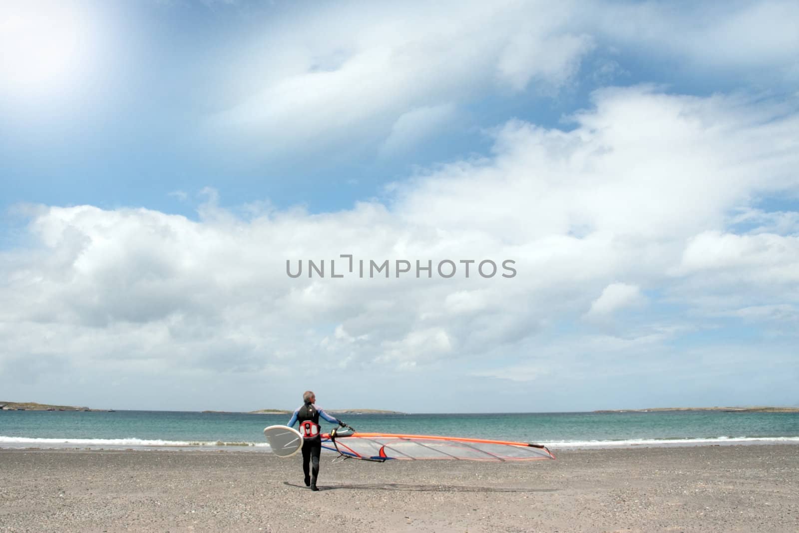 windsurfer getting ready to surf by morrbyte
