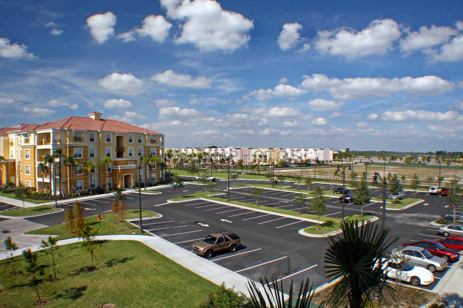 View over car park and colorful buildings.