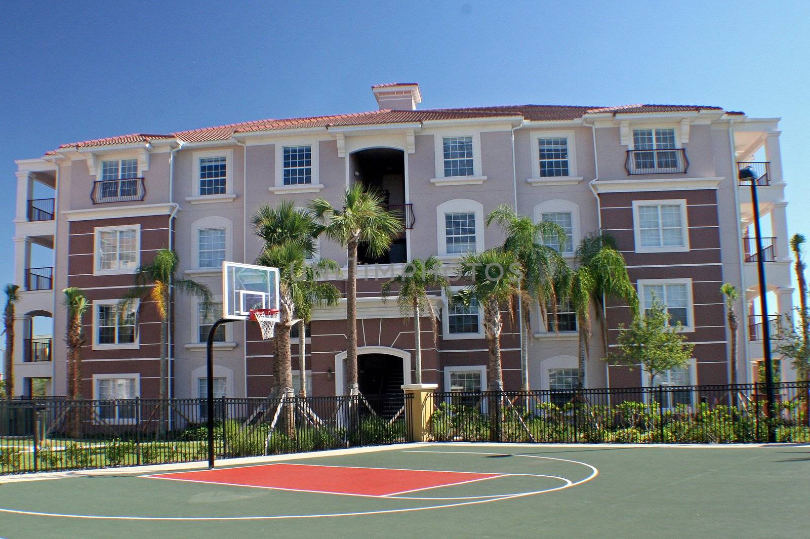 Colorful building behind basketball court in Florida.
