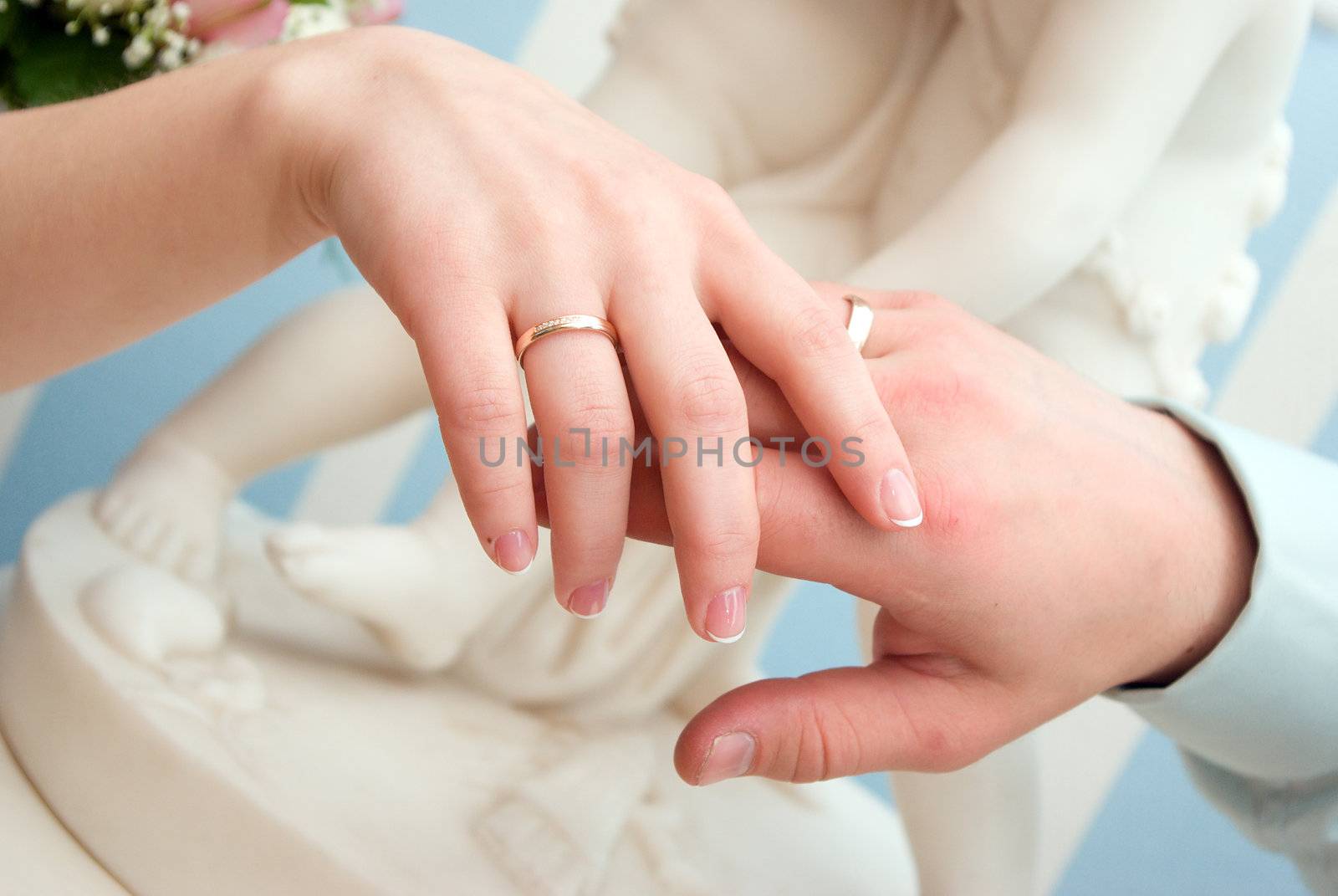 Married couple shows off rings.wedding ring 