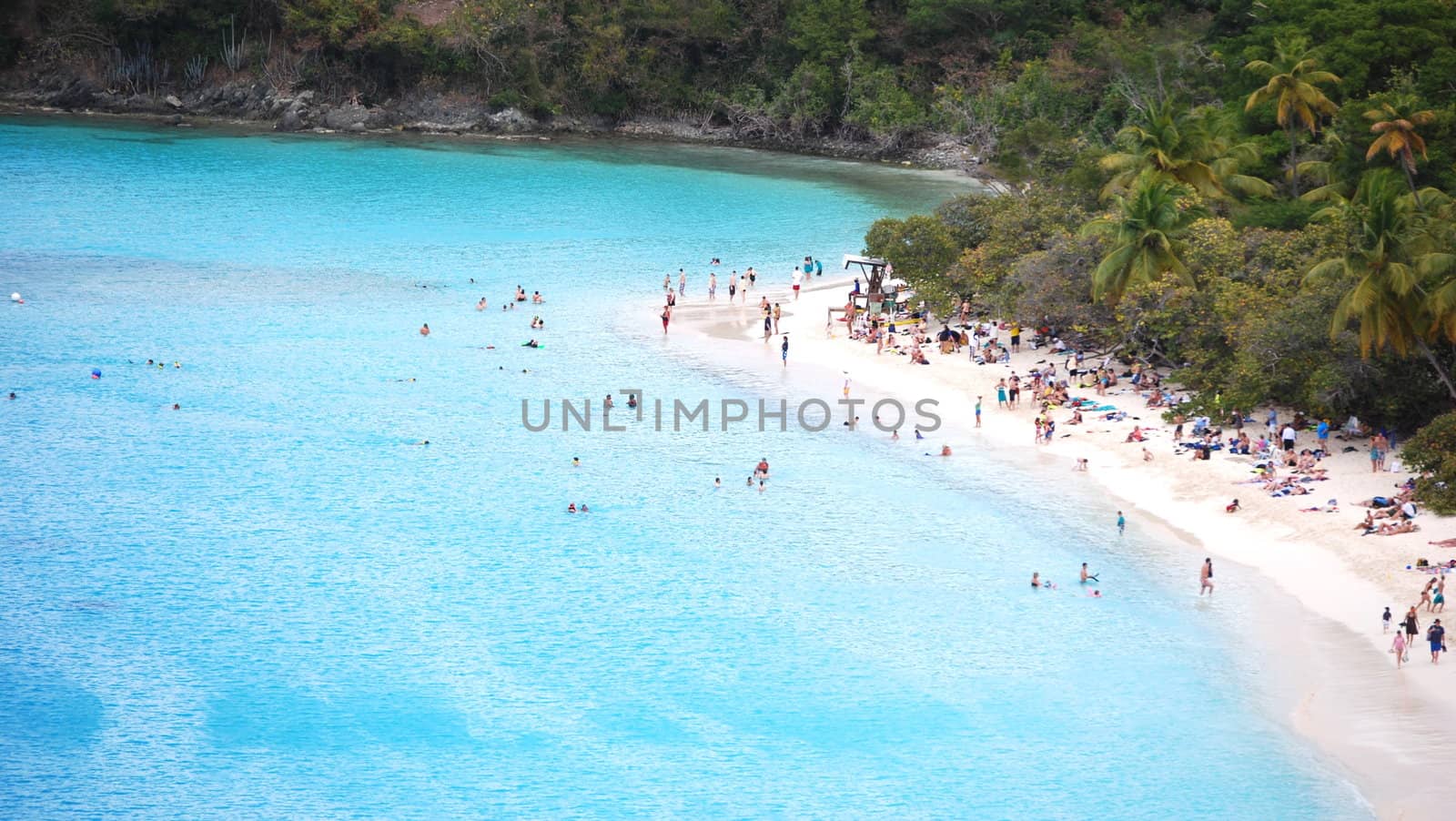 Bathers enjoy warm Caribbean waters.