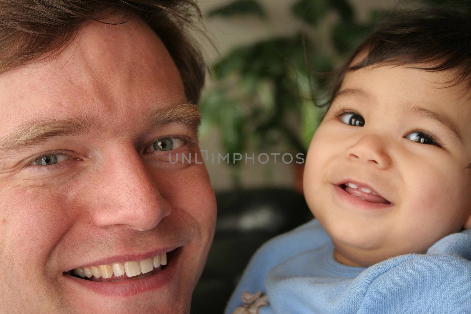 Smiling father and baby by jarenwicklund