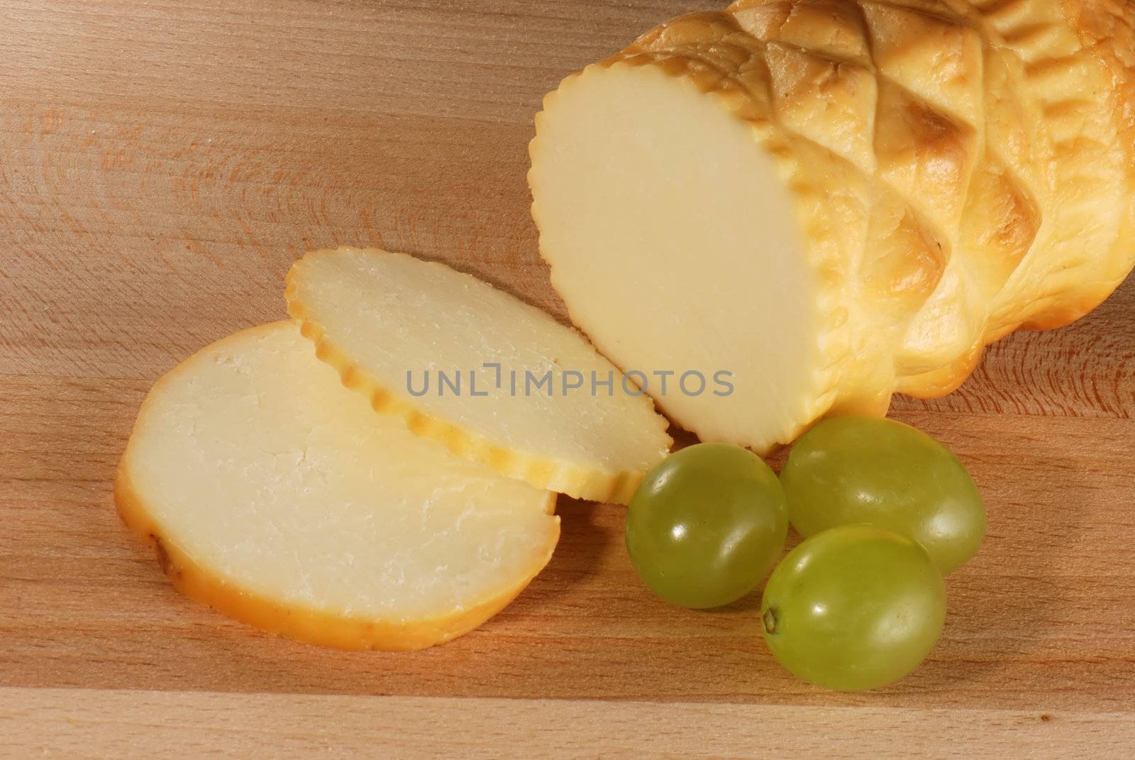 Traditional Polish cheese known as oscypek on a wooden board