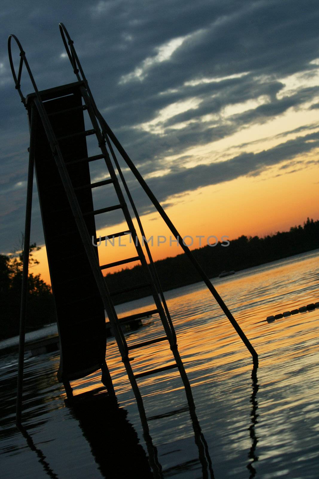 Slide set into lake at sunset