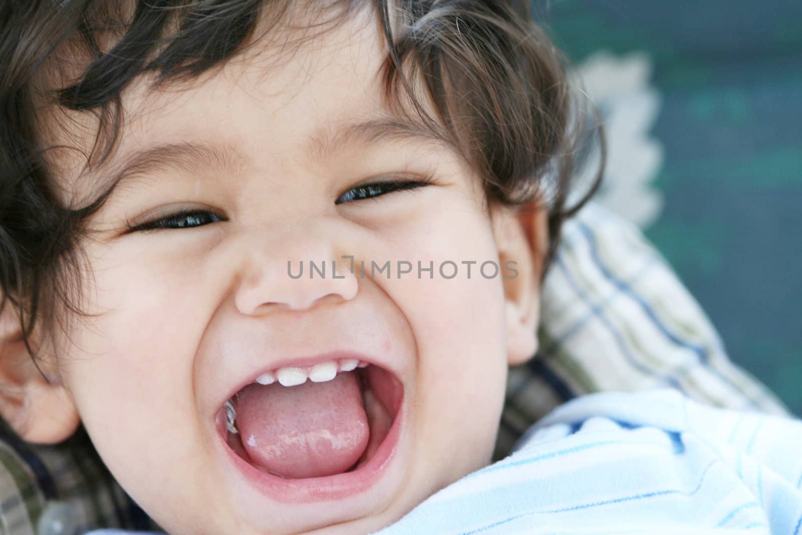 Baby boy mouth wide open in a big smile, part Scandinavian, Thai descent