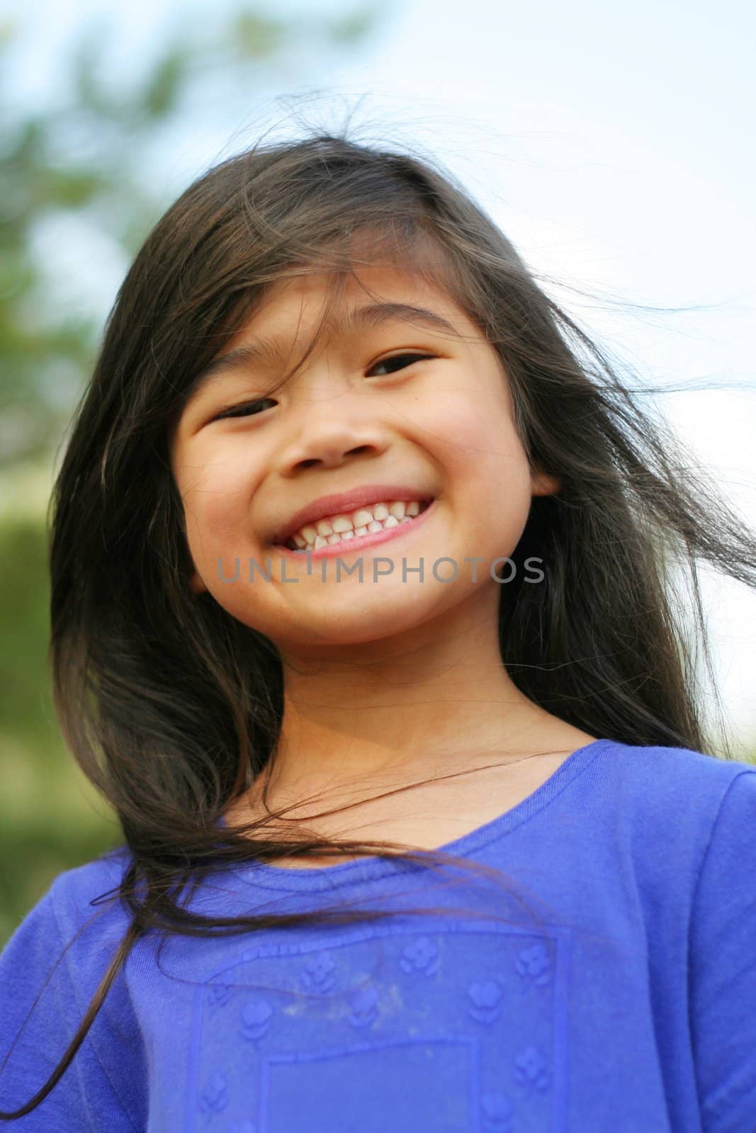 Sweet six year old girl smiling wide , part Scandinavian,asian descent