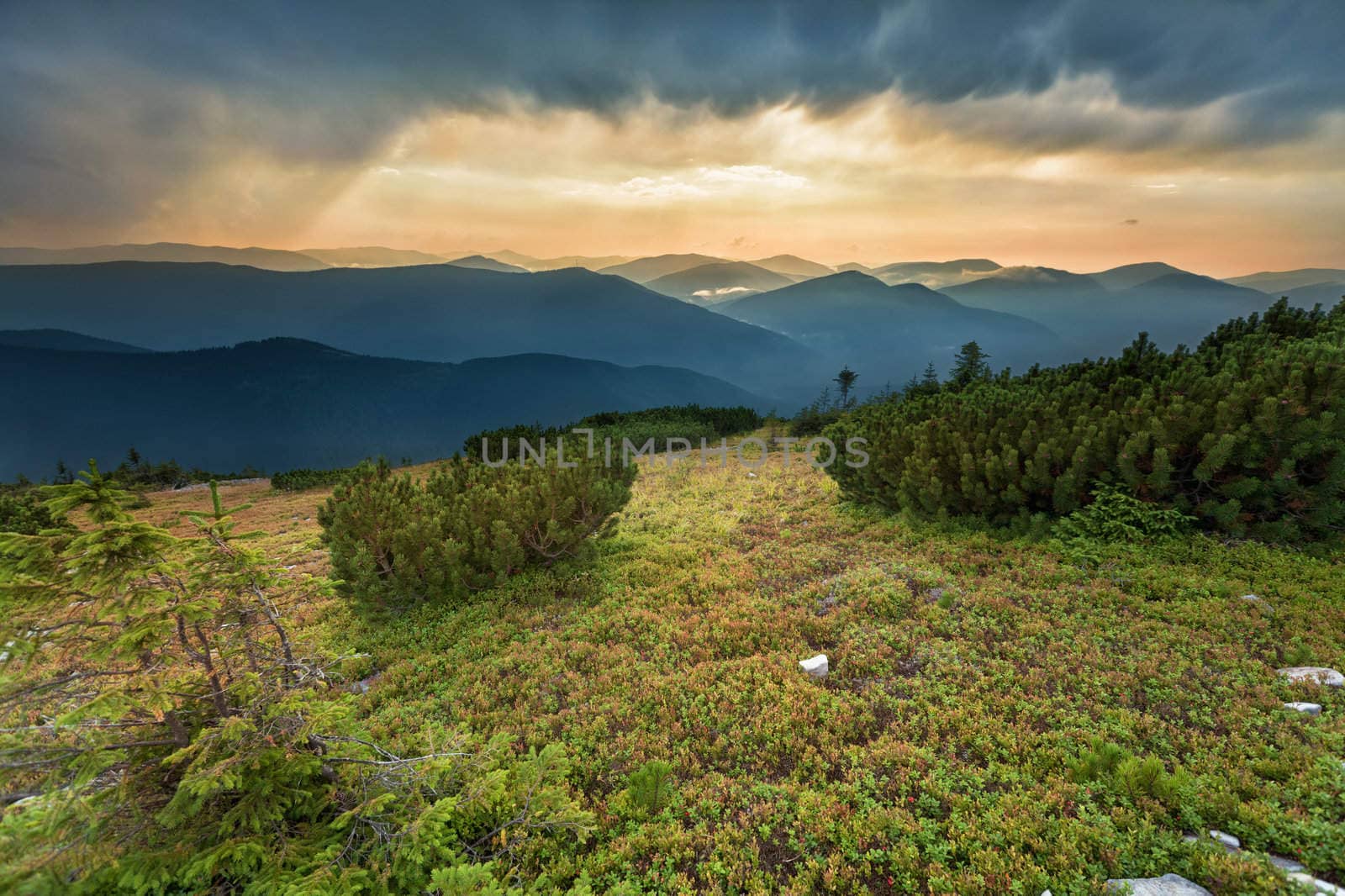 Beautiful sunset in the mountains with dramatic sky