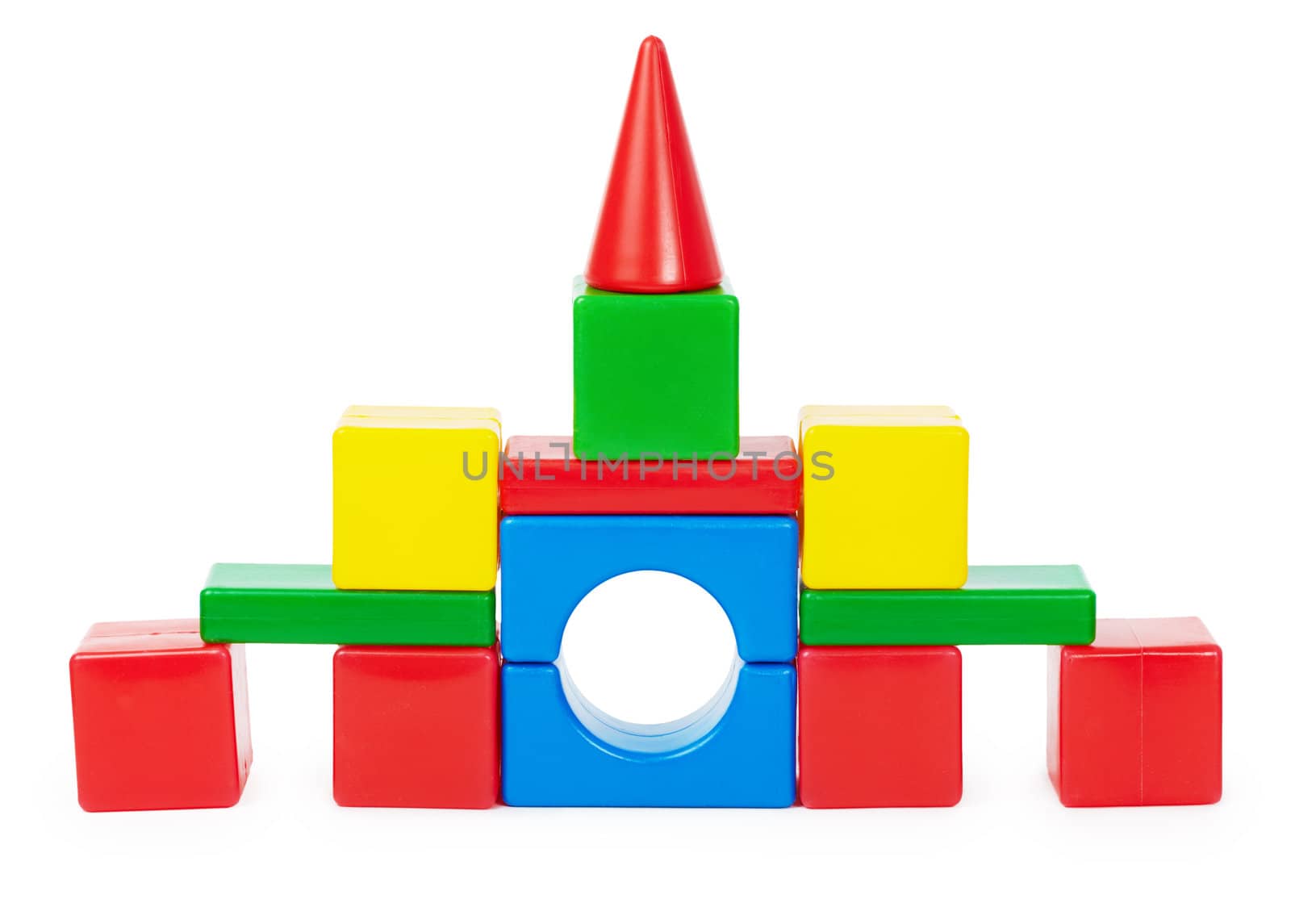 Toy castle of colored plastic blocks isolated on white background