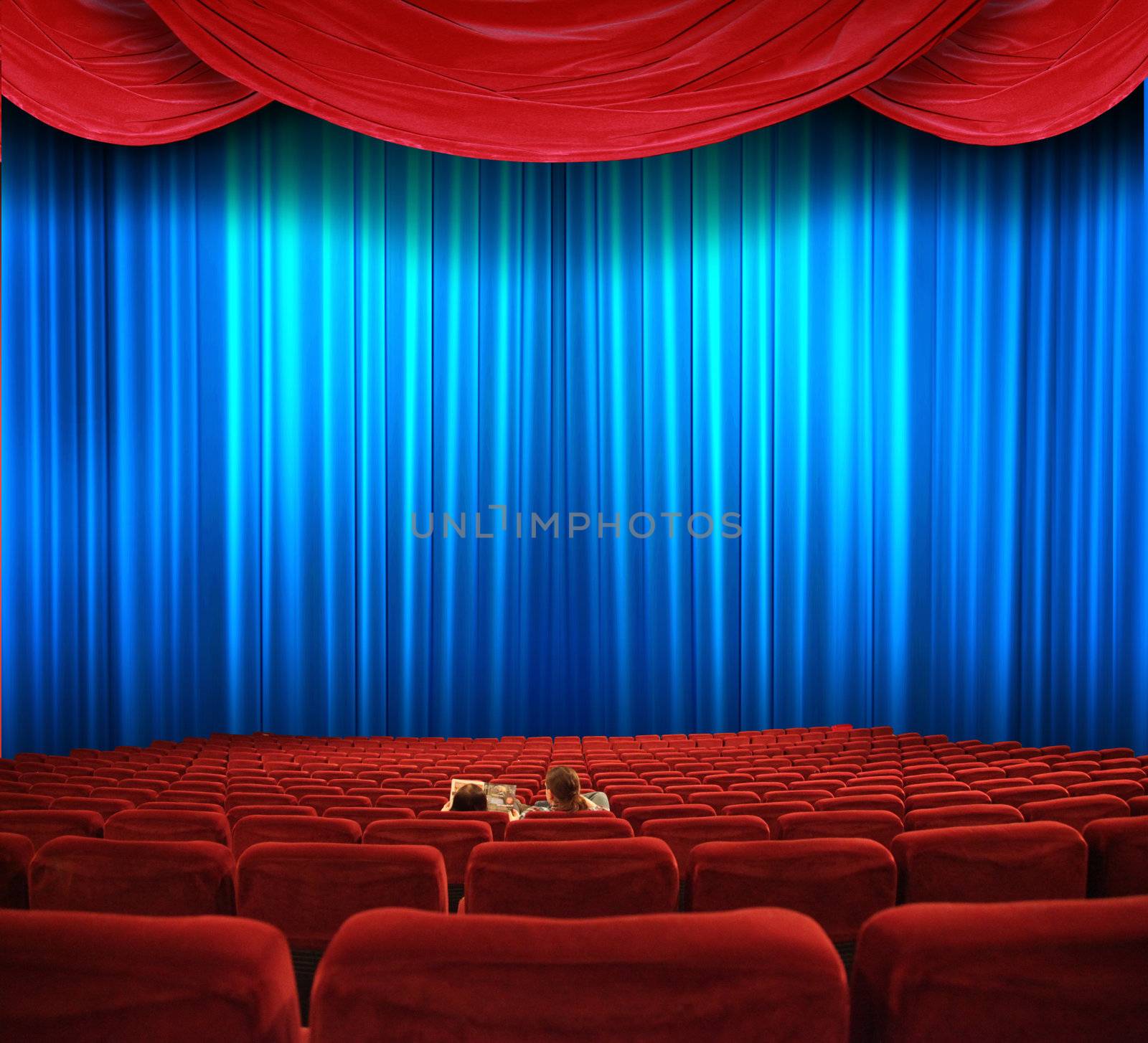 In a movie theater  by photochecker