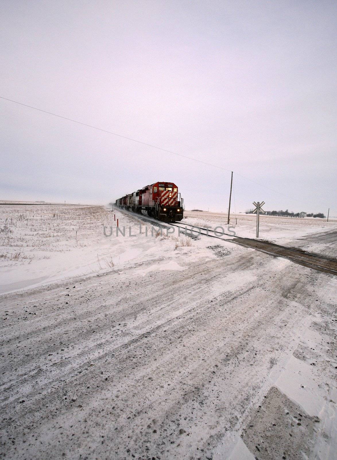 Diesel engine approaching road crossing in winter by pictureguy