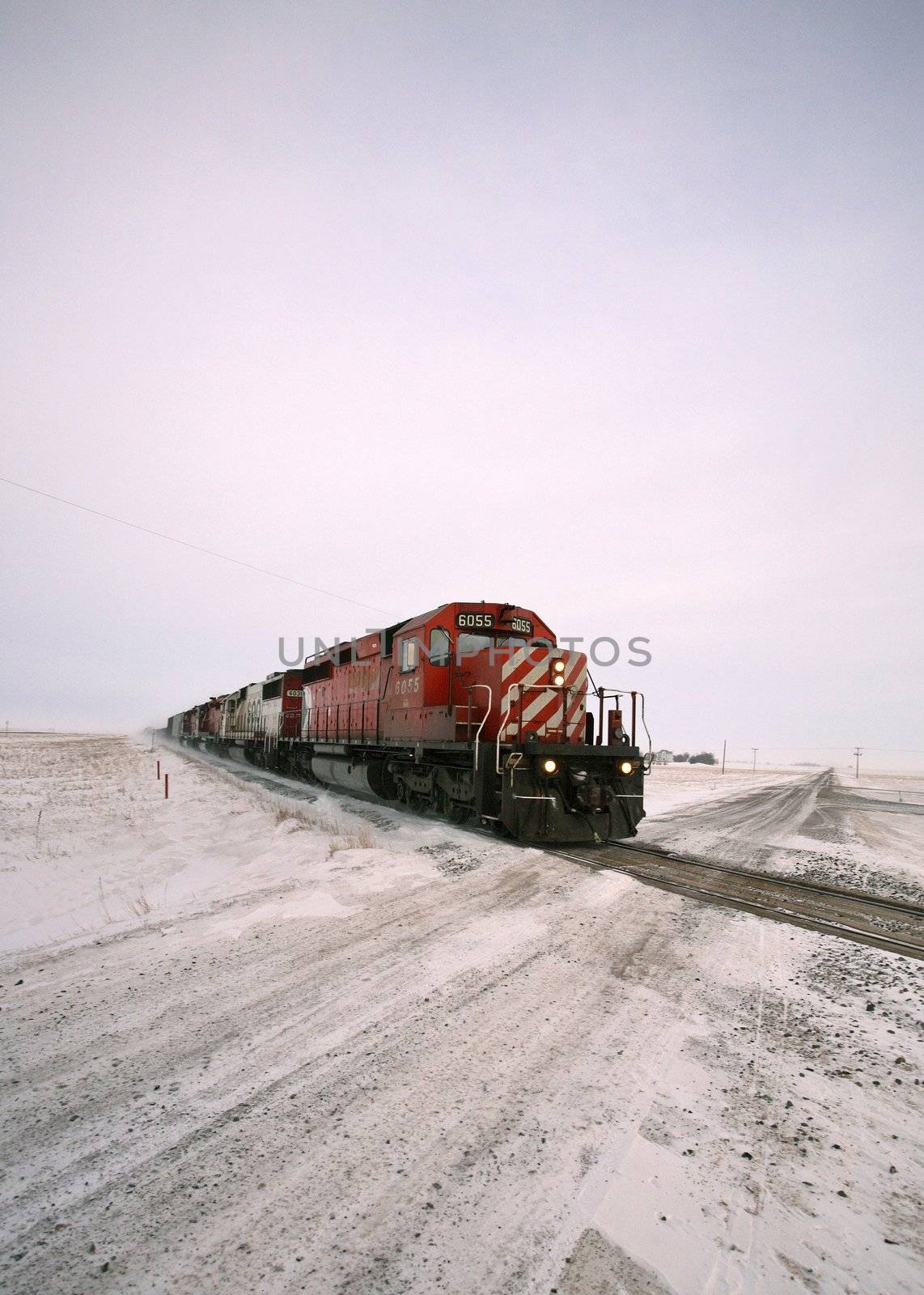 Diesel engine approaching road crossing in winter by pictureguy