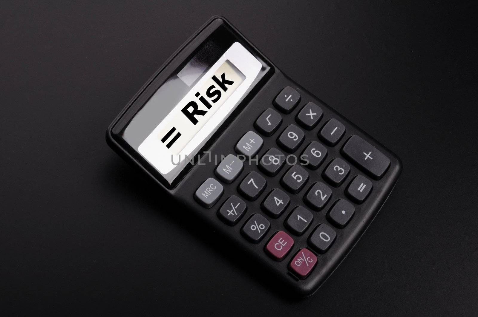 risk management concept with calculator showing financial success