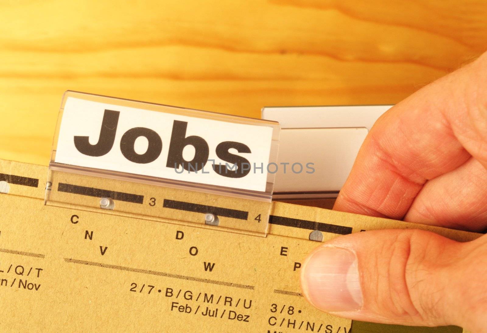 jobs or job concept with business folder in office showing earnings concept
