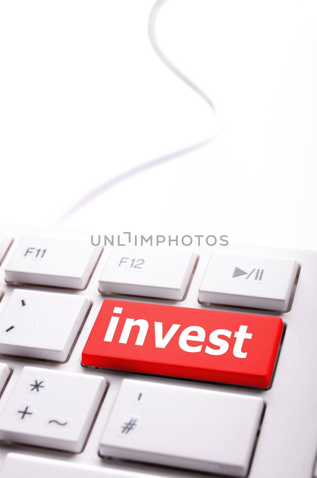 invest or investment key or button in red showing business success