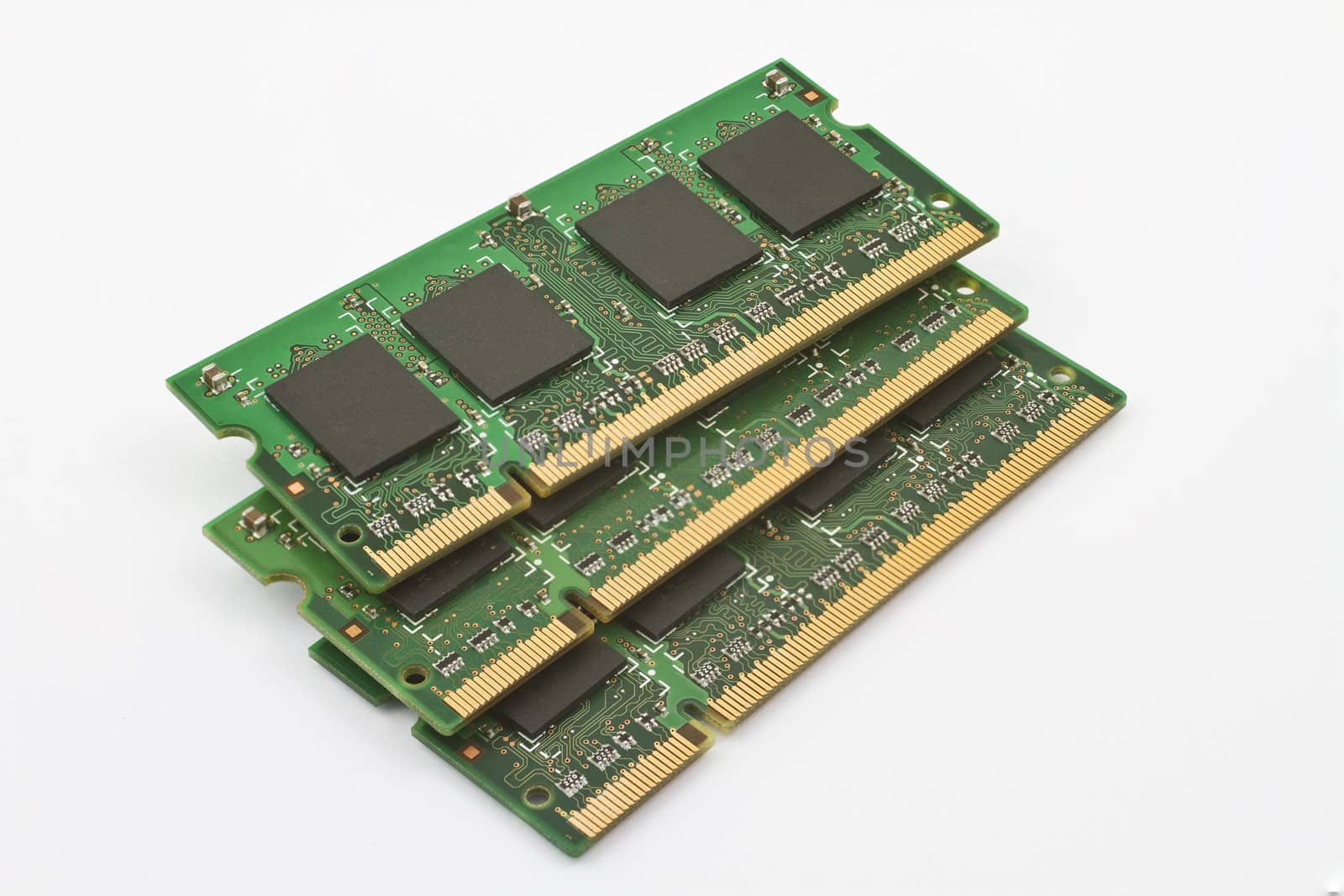 three notebook memory modules on neutral background
