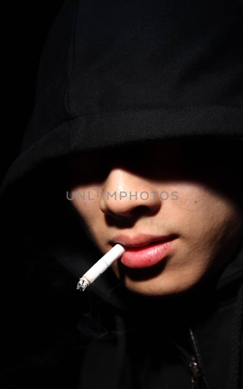 Monochrome picture of a guy in a hood 