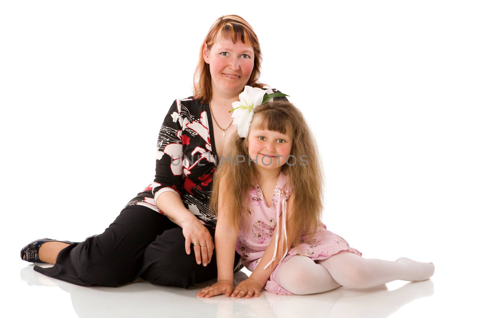 Mother with daughter sitting on chair isolated on white