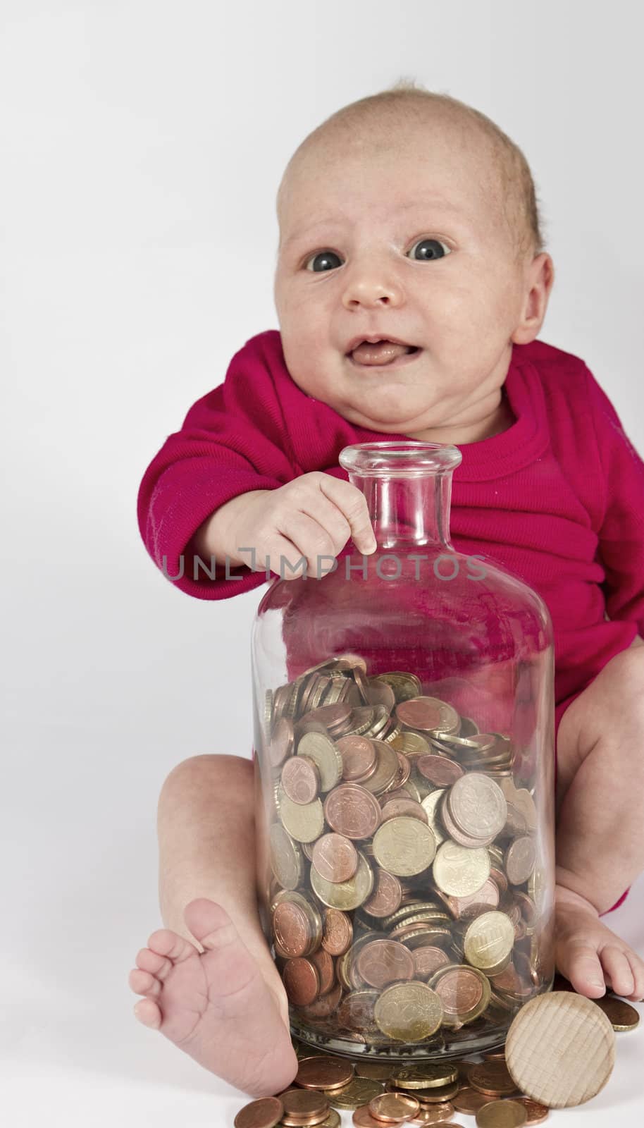 nursling with money in bottle looking at camera