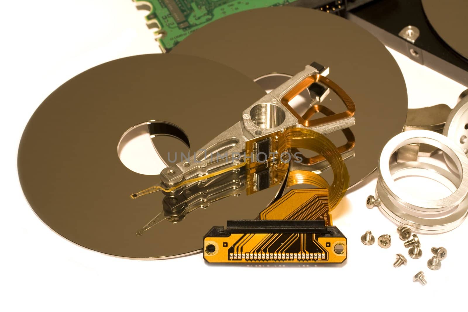 several parts of hard disk drives on light background