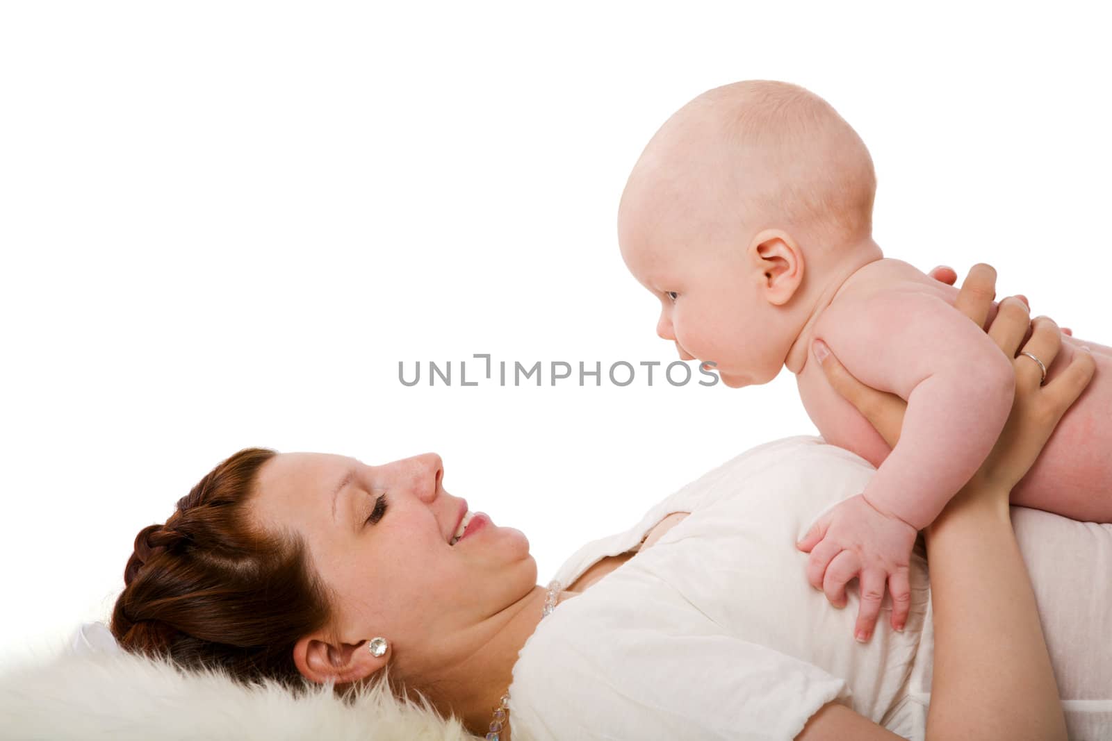 Happy mother holding her baby closeup portrait