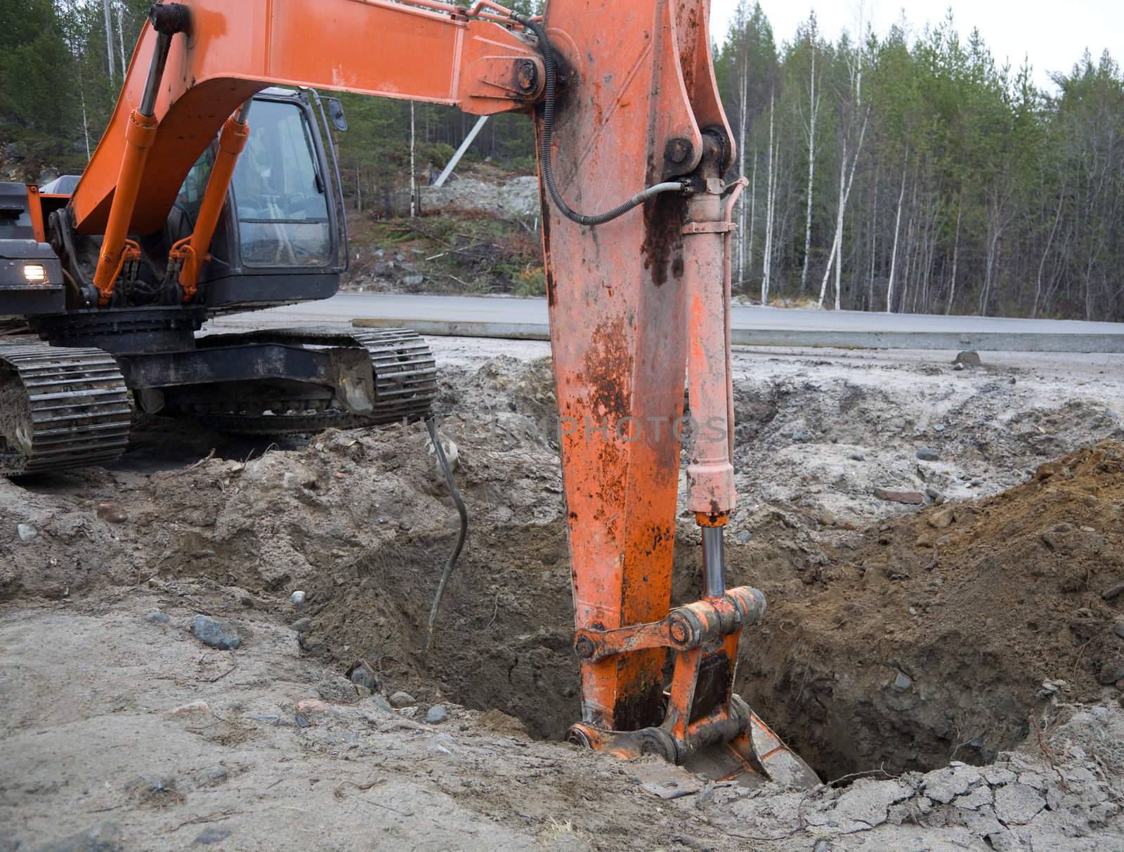 Crawler excavator working on the roadside