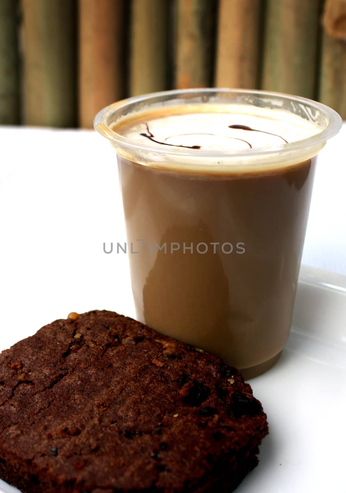 A delicious plate served with coffee and a scrumptious cake.