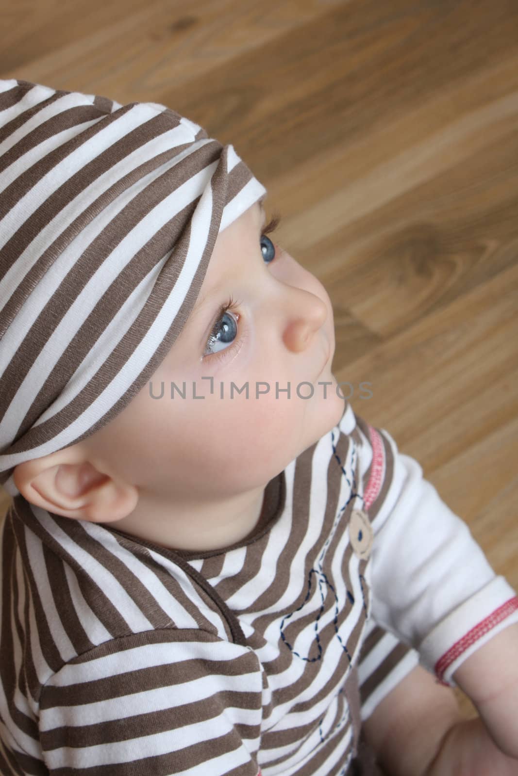 Cute baby boy with big blue eyes