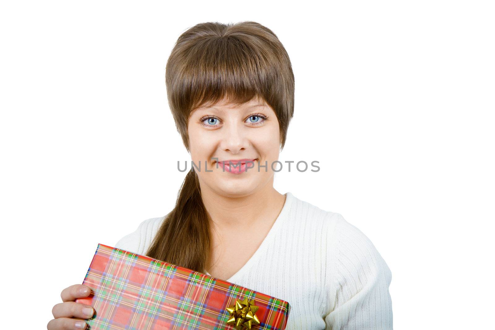 pretty smiling young woman with a gift on a light background. Studio photography