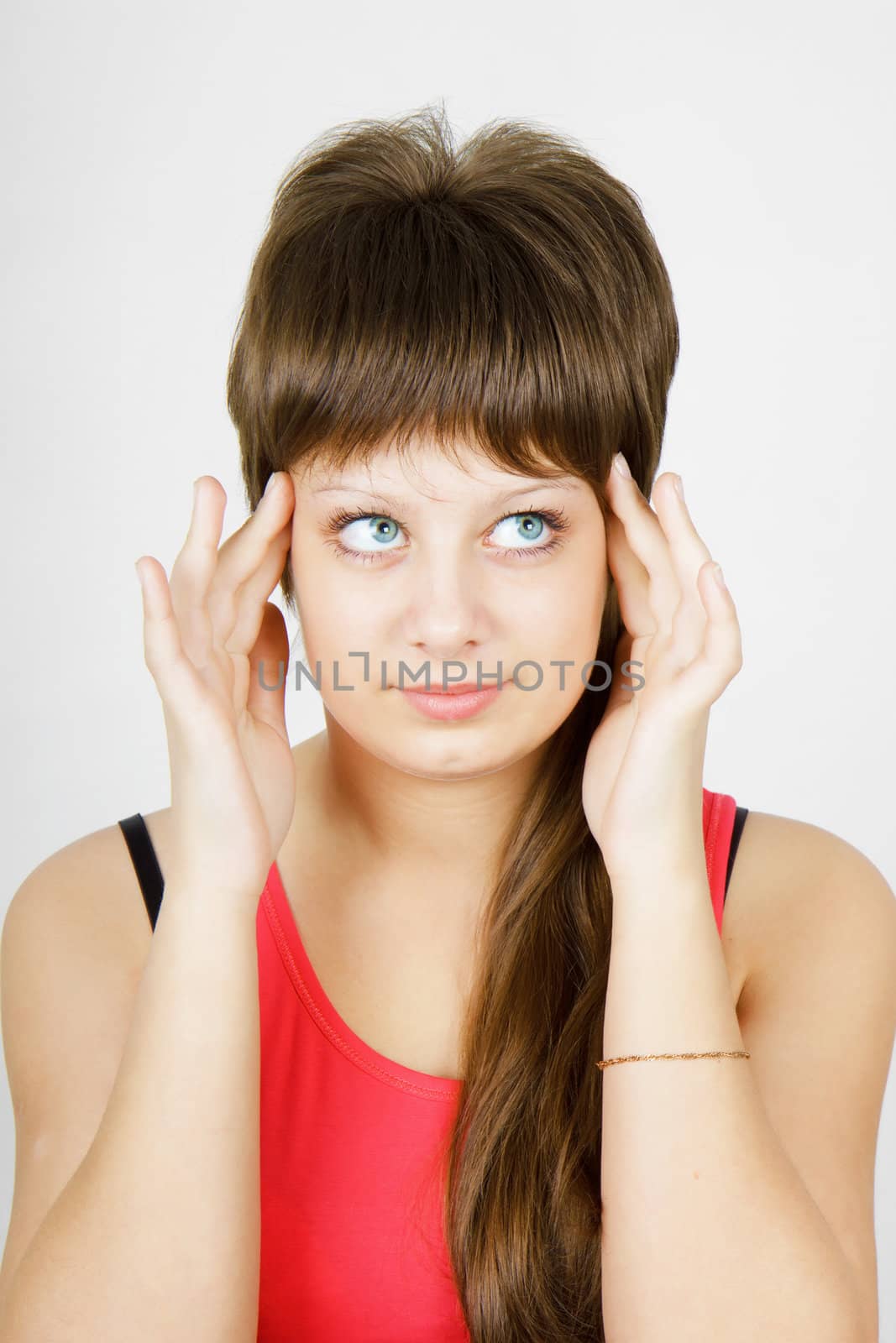 portrait of a beautiful girl with a headache
