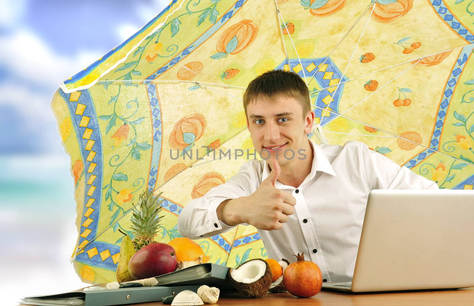 young business man on vacation showing thumbs up