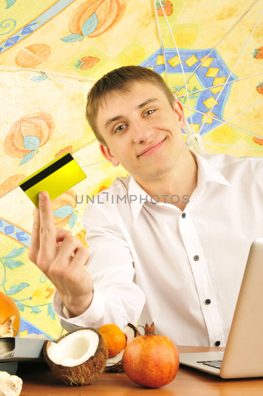 young businessman holding plastic card    by HASLOO