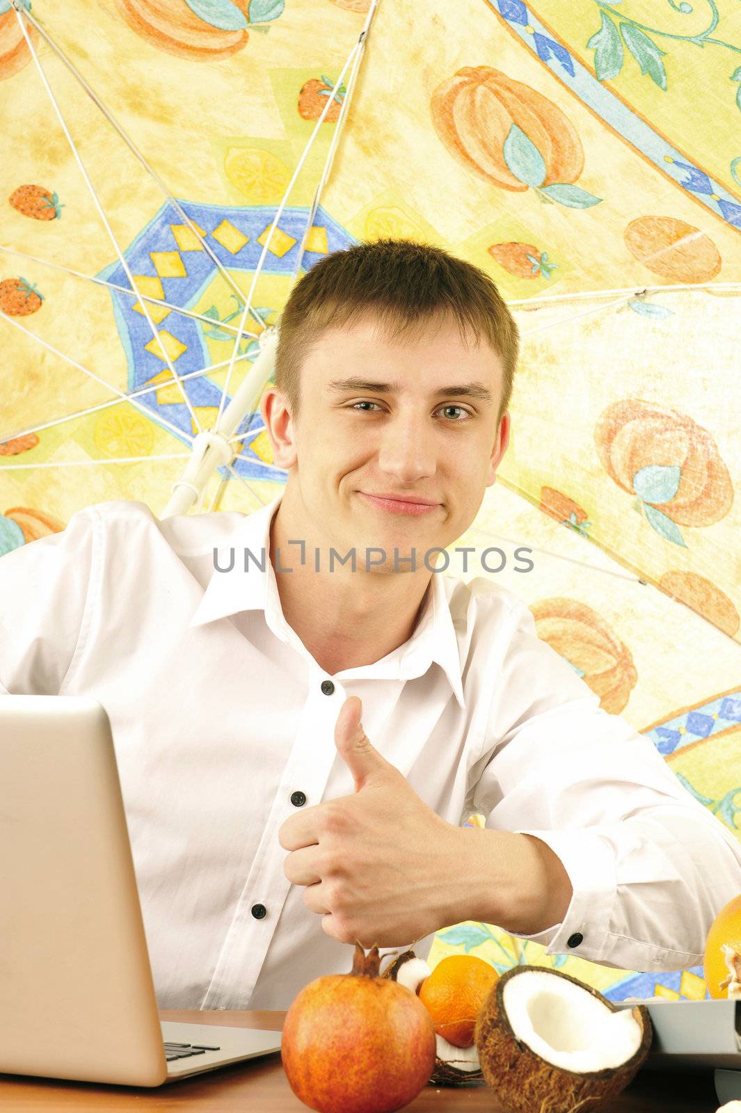 young business man on vacation showing thumbs up