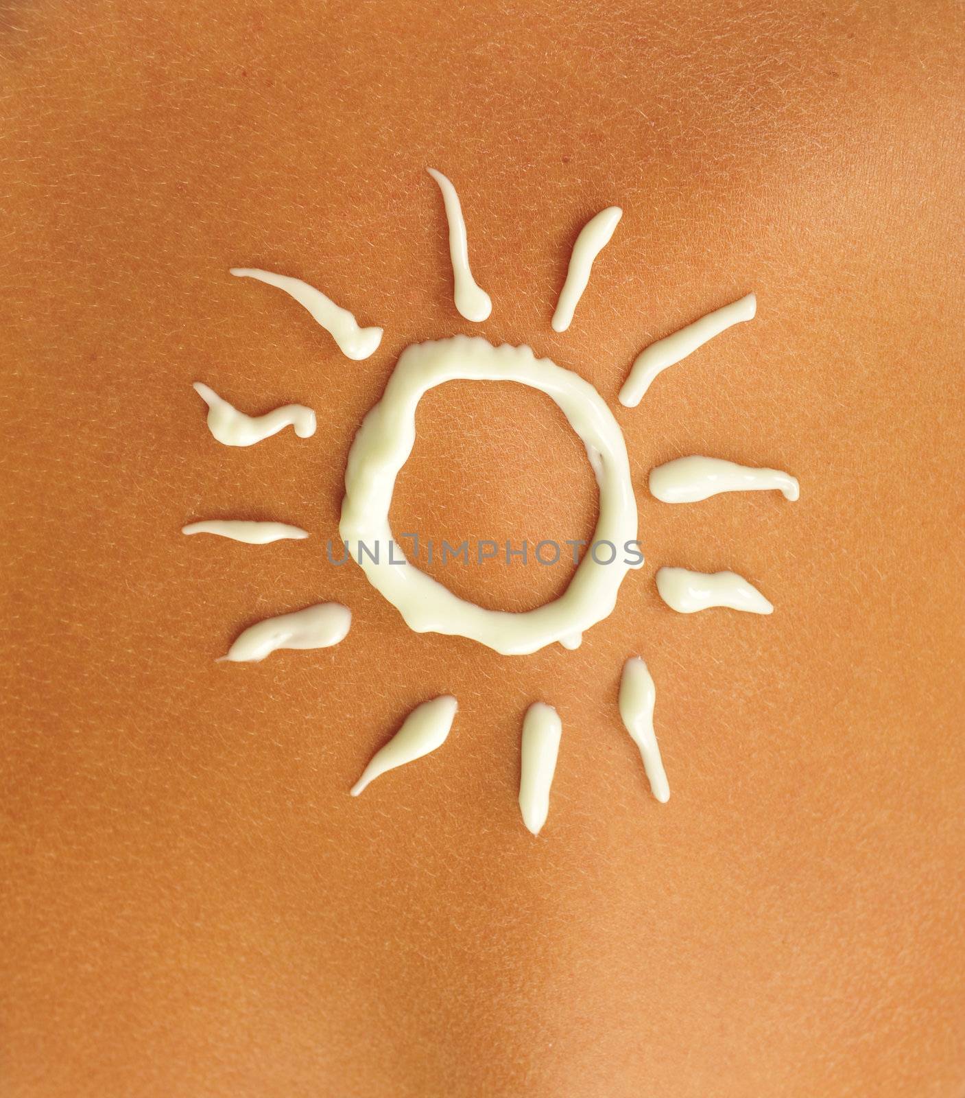 cream sun on a tanned skin