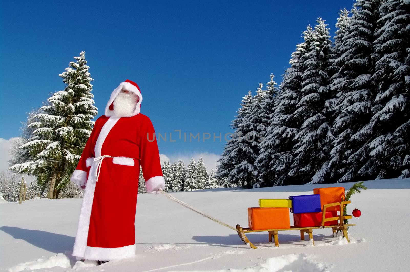 Santa Claus, Father Christmas with colorful presents on a sledge
